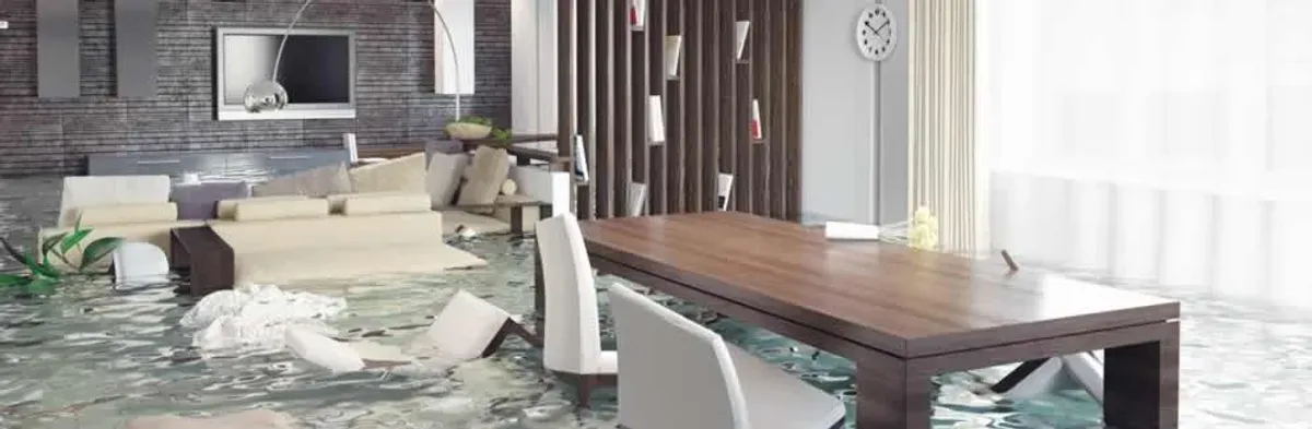 home interior affected by water damage with flooded floors and displaced furniture in Las Vegas, NV